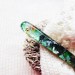 Green hair stick with mother of pearl