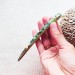 Green hair stick with mother of pearl