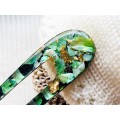 Hair fork with green seashells and wood